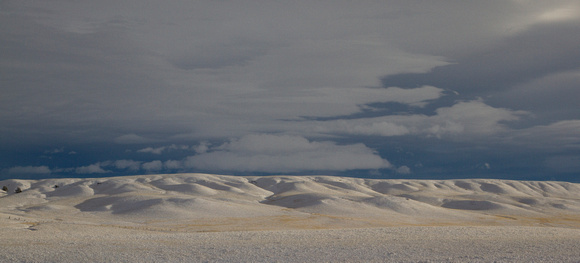 Snowy Hills and Stormy Skies